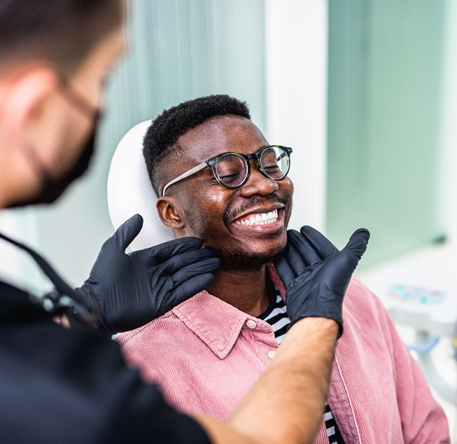 Man smiling at the dentist